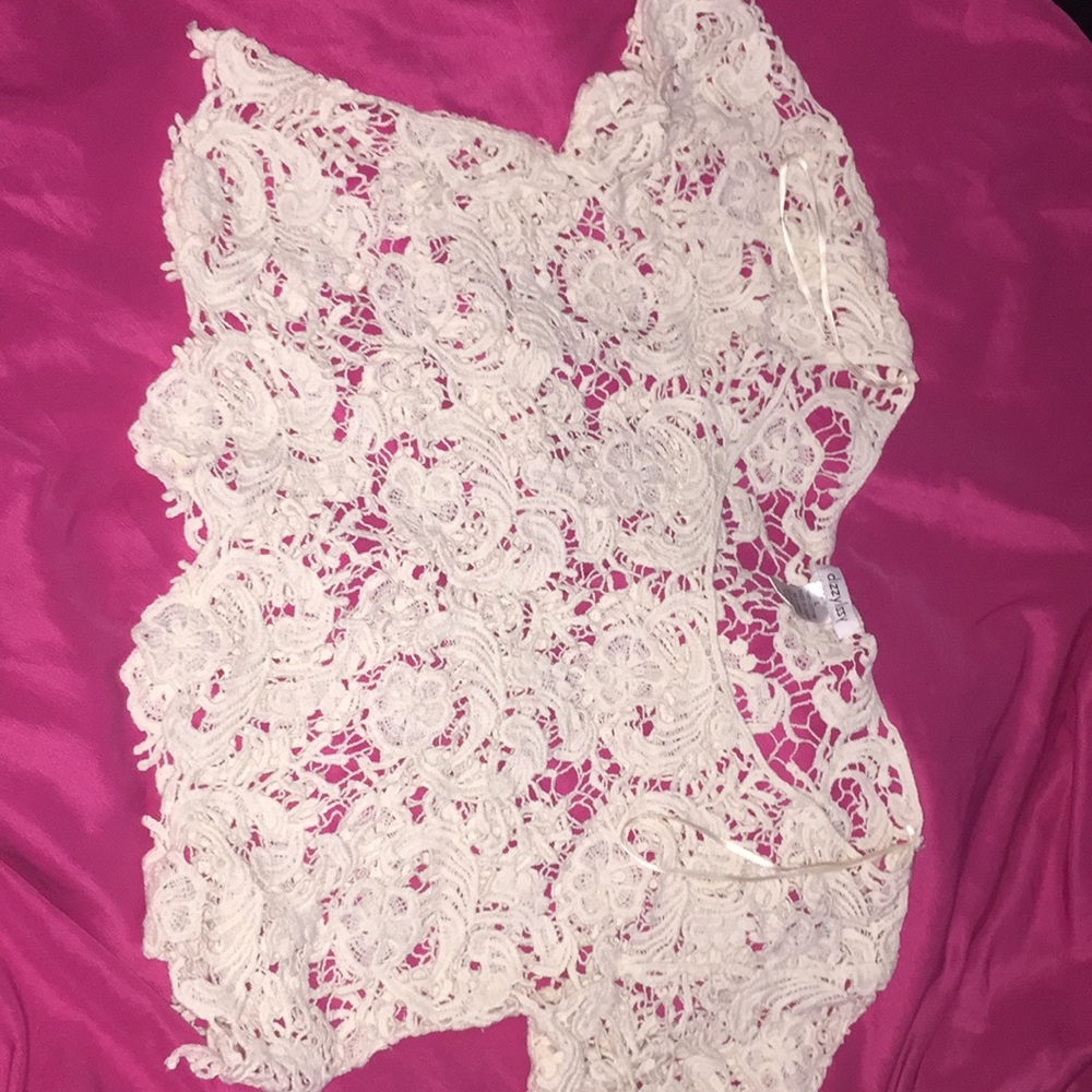 A cream white crochet crop top
